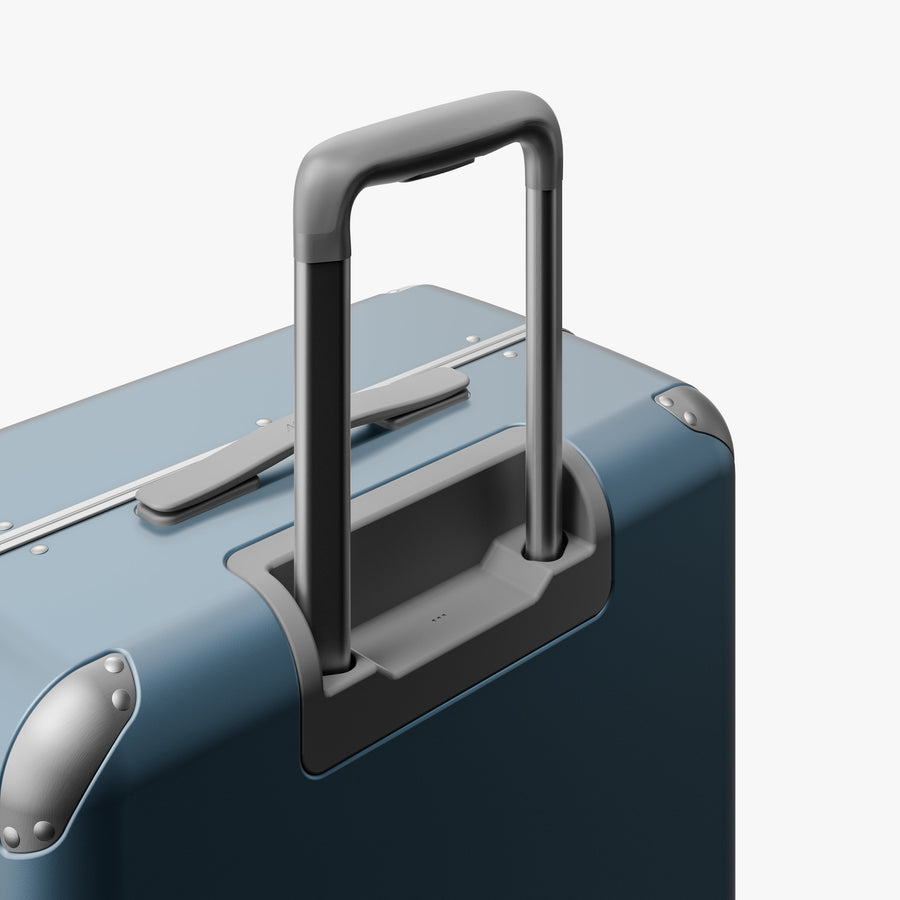 Elemental Blue | Extended luggage handle view of Hybrid Check-In Medium in Elemental Blue