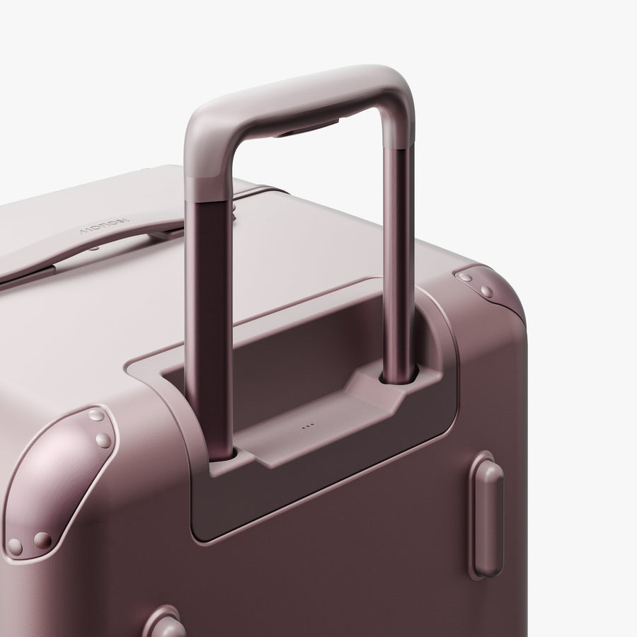 Orchid | Extended luggage handle view of Hybrid Trunk in Orchid