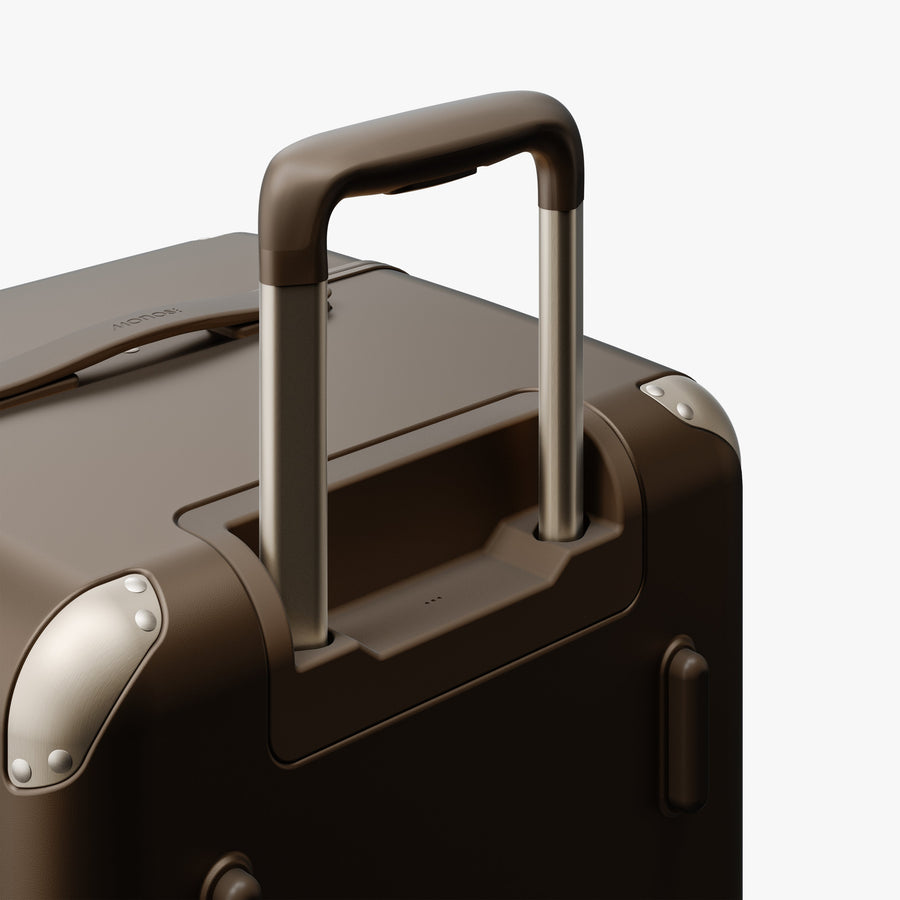 Adobe Brown | Extended luggage handle view of Hybrid Trunk in Adobe Brown