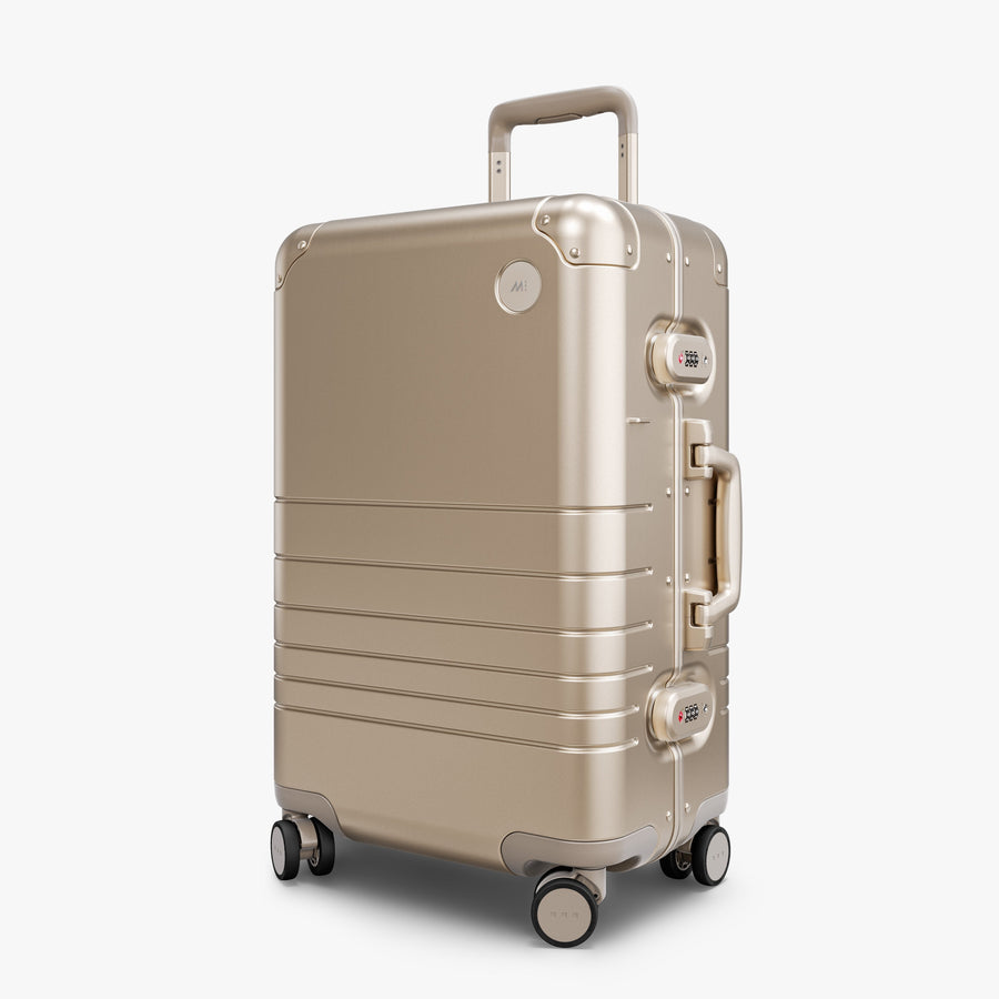 Champagne Gold | Angled view of Aluminum Carry-On Plus in Champagne Gold