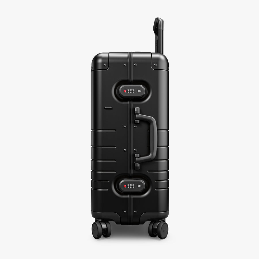 Caviar Black | Side view of Aluminum Carry-On Plus in Caviar Black