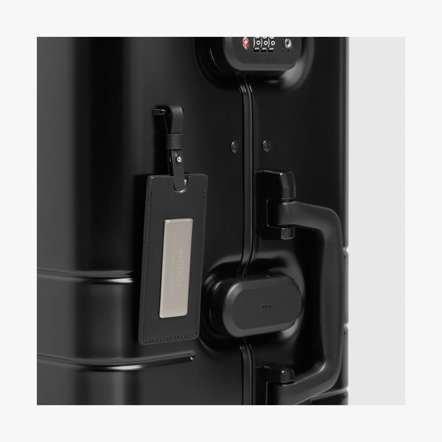 Caviar Black | Luggage tag view of Aluminum Check-In Large in Caviar Black