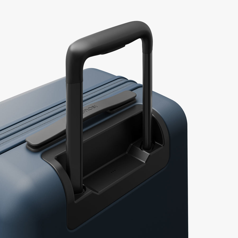Ocean Blue | Extended luggage handle view of Expandable Carry-On in Ocean Blue