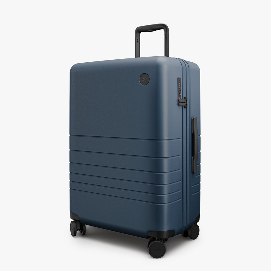 Ocean Blue | Angled view of Expandable Check-In Medium in Ocean Blue