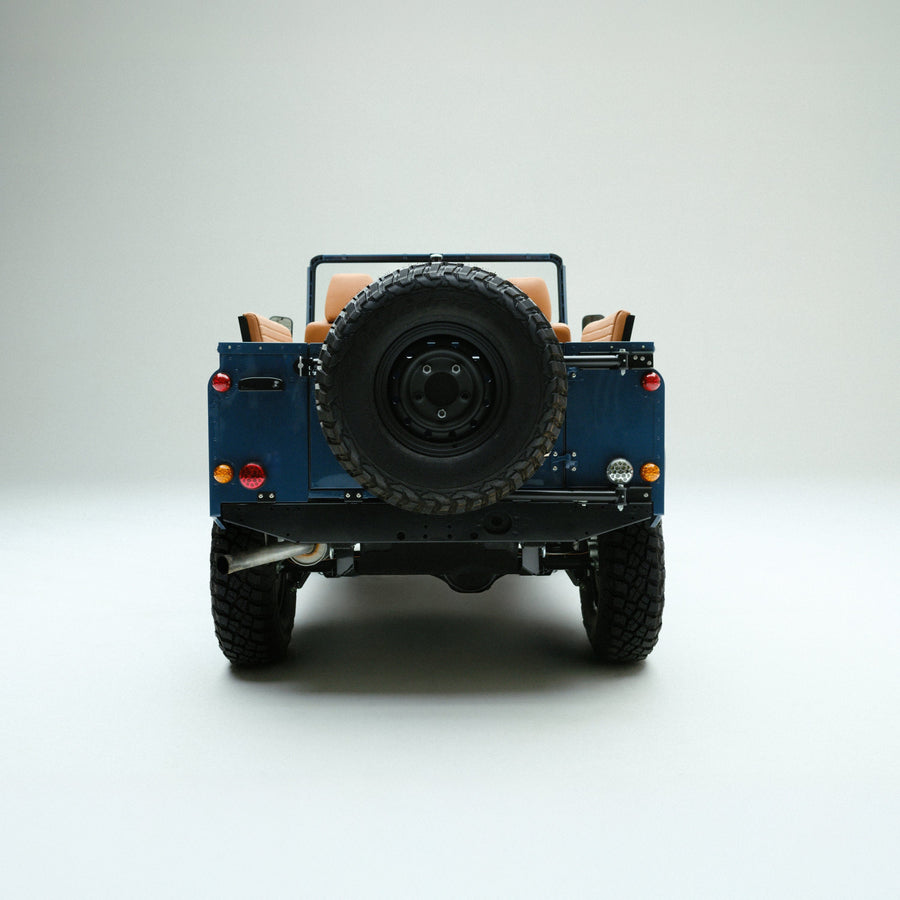 Arles Blue | Back view of Land Rover Defender in Arles Blue