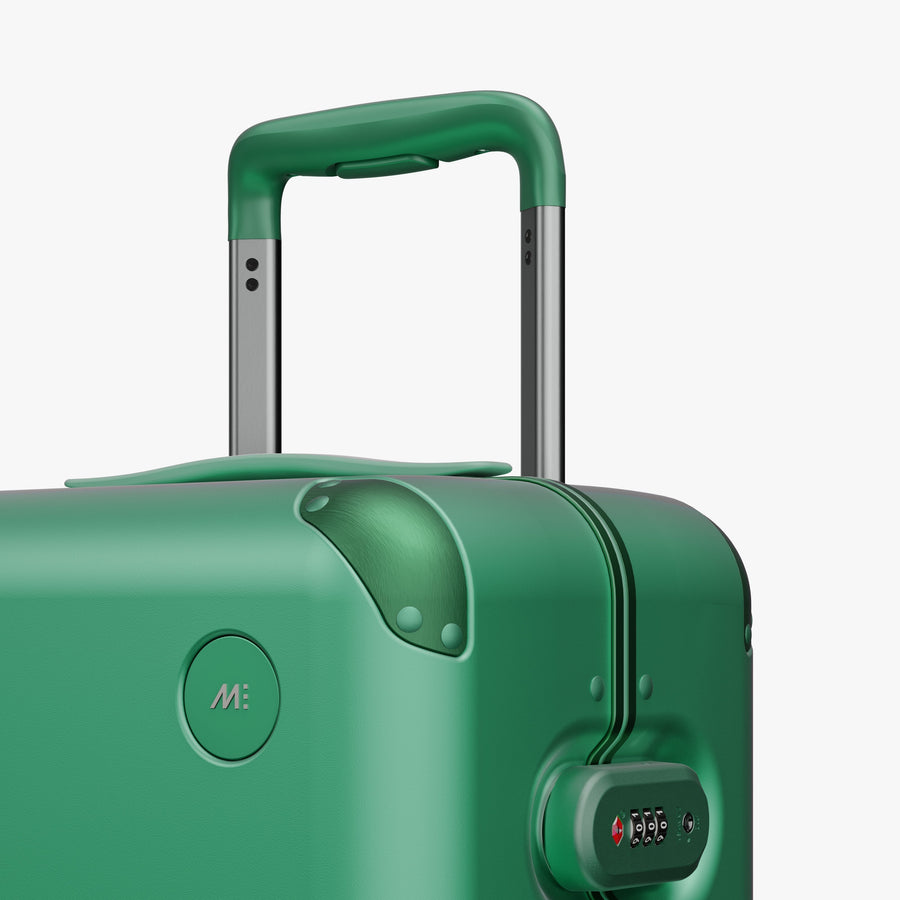 Jungle Green | Close-up view of the logo detail on the Hybrid Carry-On in Jungle Green