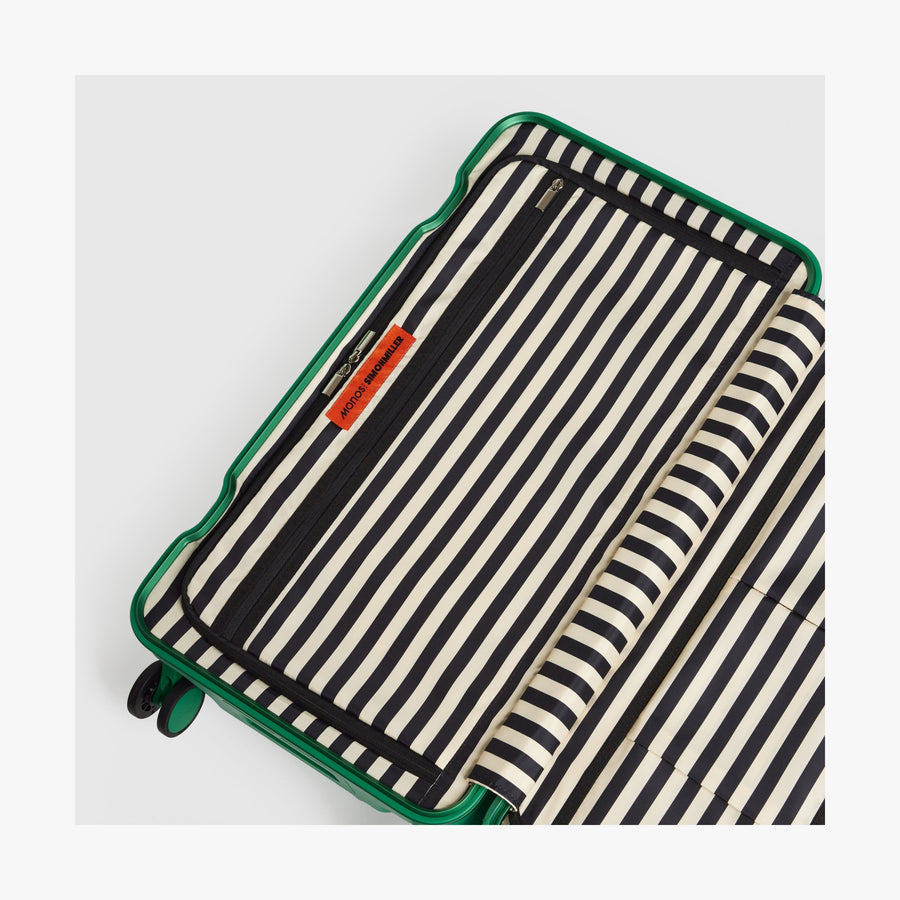 Jungle Green | Interior view of a Hybrid suitcase in Jungle Green featuring the Poplin Stripe Jungle Green zipped compartment