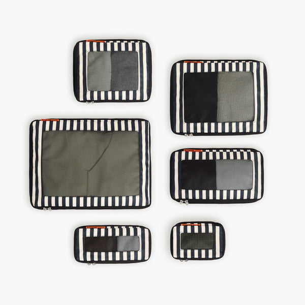 Set of Six / Poplin Stripe Black | Set of six Poplin Stripe Black compressible packing cubes arranged flat to show all sizes