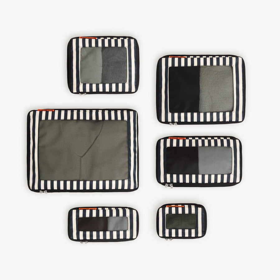 Set of Six / Poplin Stripe Black | Set of six Poplin Stripe Black compressible packing cubes arranged flat to show all sizes