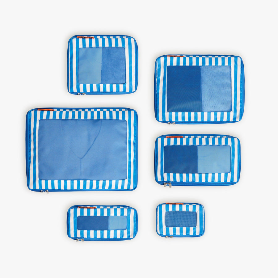 Set of Six / Poplin Stripe Coastal Blue | Set of six Poplin Stripe Coastal Blue compressible packing cubes arranged flat to show all sizes