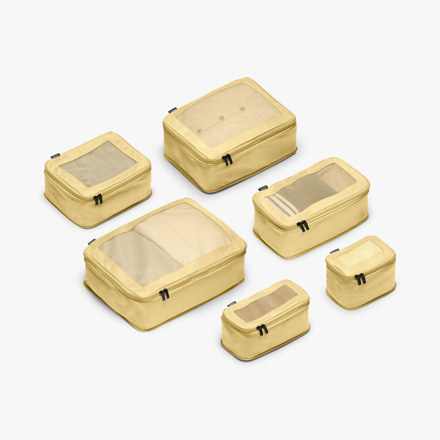 Set of Six / Banana Pudding | This is a photo of a set of six compressible packing cubes in Banana Pudding