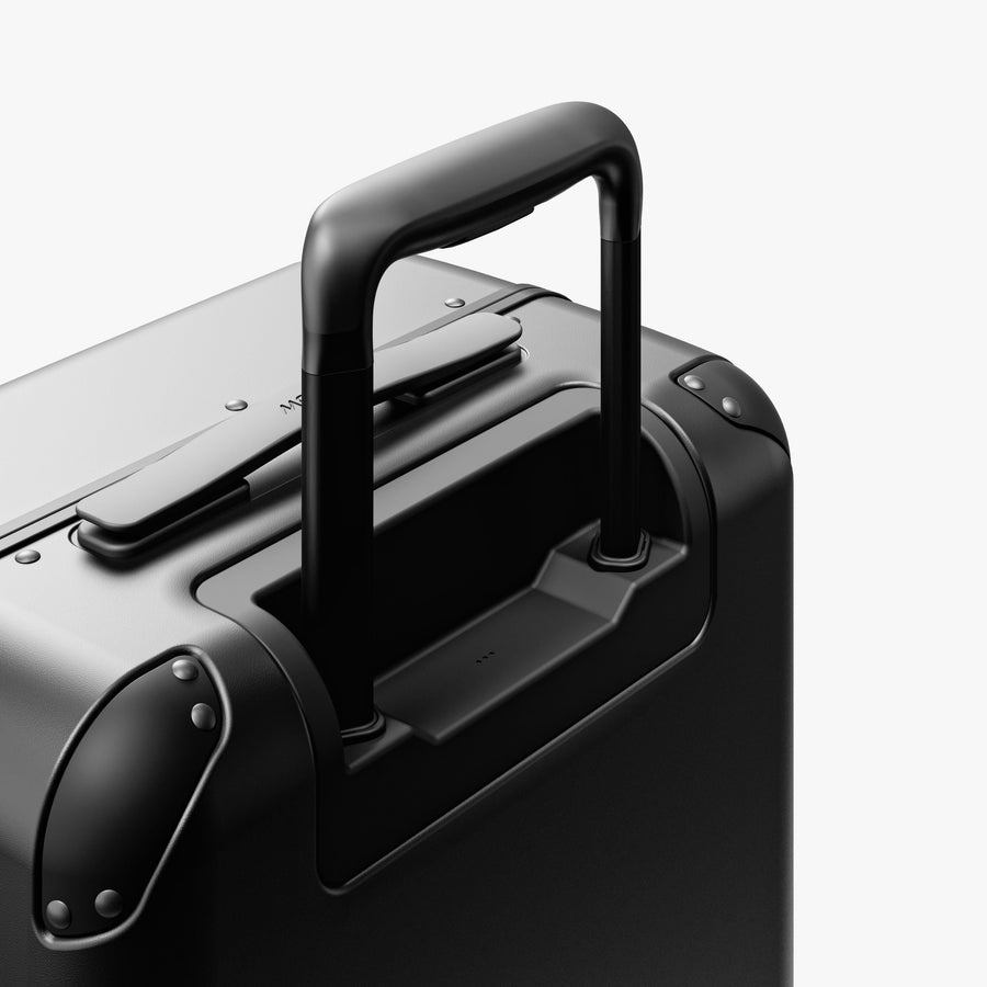 Obsidian | Extended luggage handle view of Hybrid Carry-On Plus in Obsidian