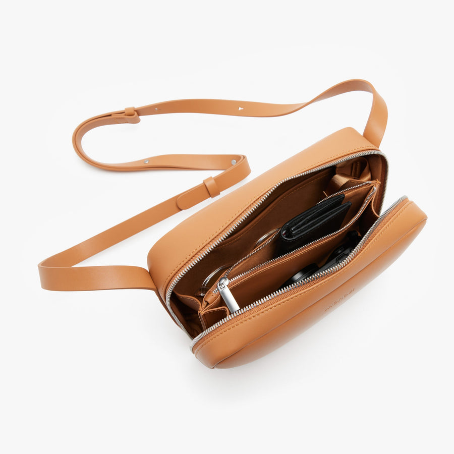 Saddle Tan (Vegan Leather) | Angled view of Metro Crossbody in Saddle Tan