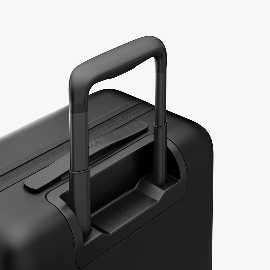 Midnight Black | Extended luggage handle view of Carry-On Pro Plus in Midnight Black