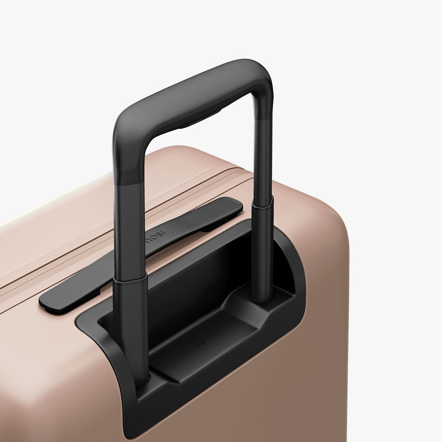 Rose Quartz | Extended luggage handle view of Carry-On Pro Plus in Rose Quartz