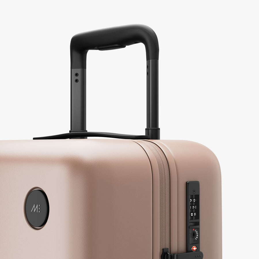 Rose Quartz | Extended luggage handle view of Carry-On Plus in Rose Quartz