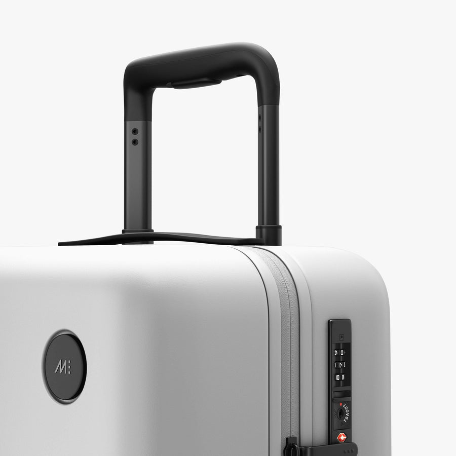 Stellar White | Luggage handle view of Carry-On Plus in Stellar White