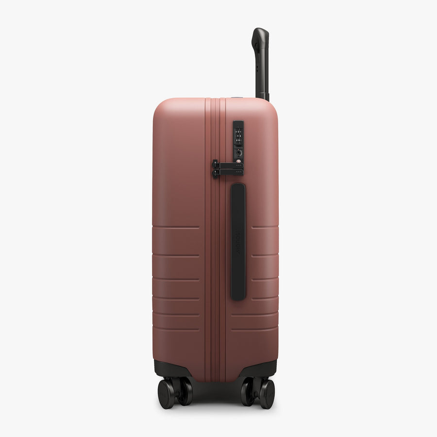 Terracotta | Side view of Carry-On Plus in Terracotta