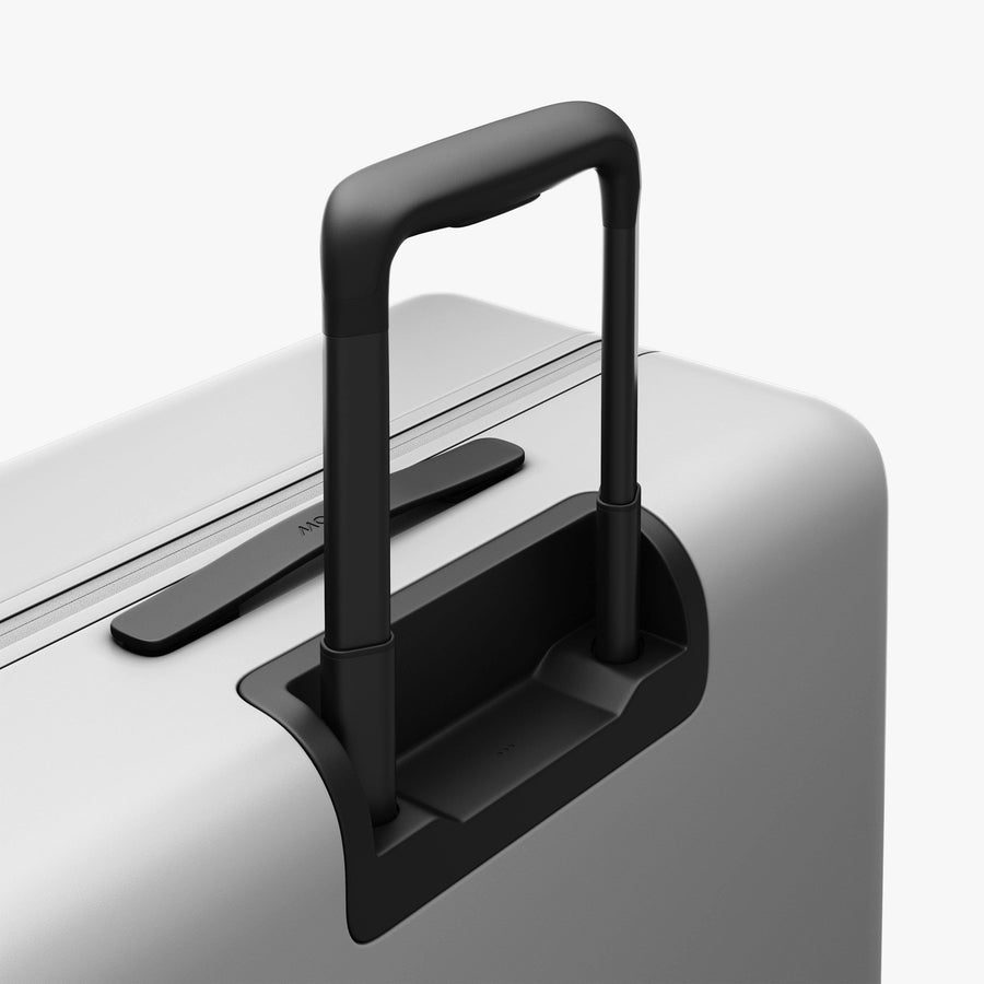 Stellar White | Extended luggage handle view of Check-In Large in Stellar White