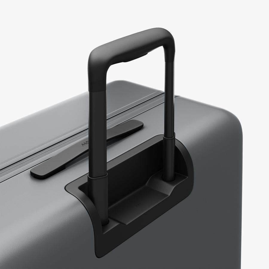Storm Grey | Extended luggage handle view of Check-In Large in Storm Grey