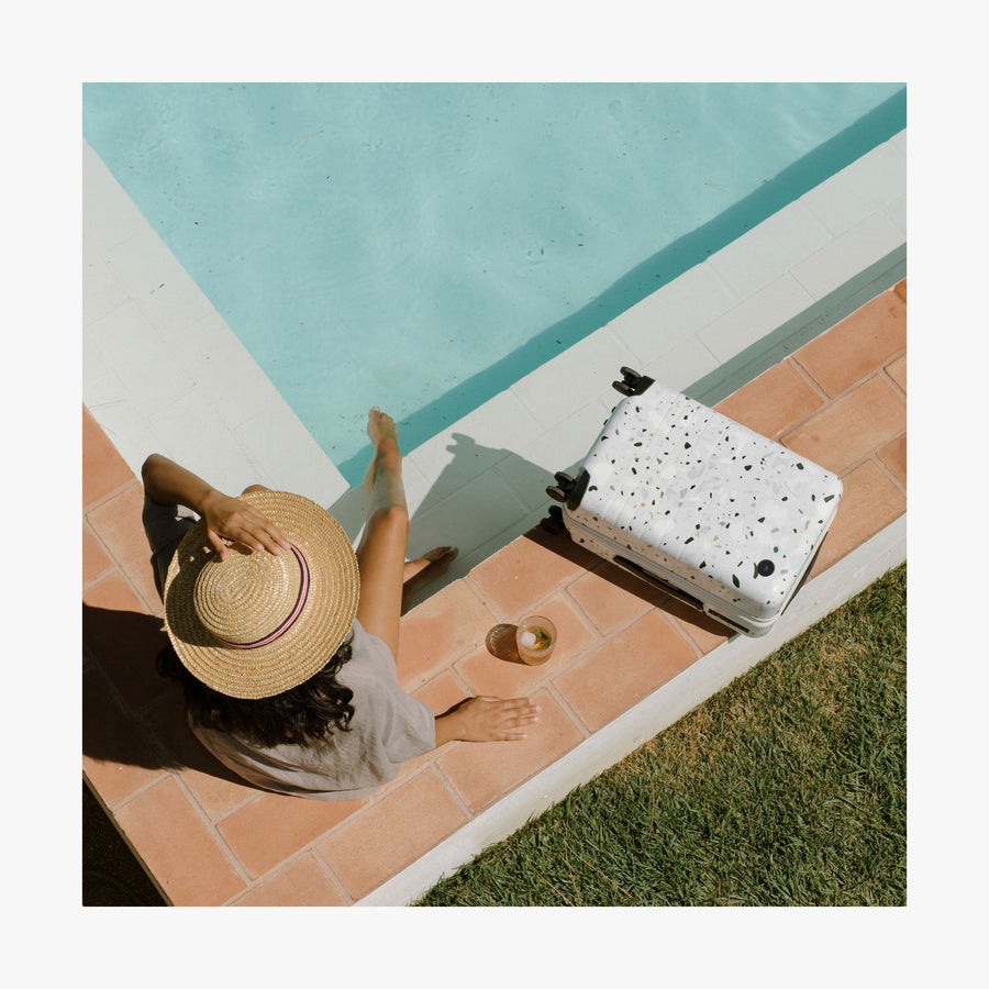 Terrazzo | This is a photo of a Terrazzo Carry-On Plus beside a pool