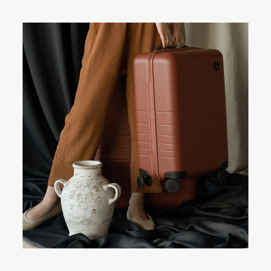 Terracotta | This is a photo of a Terracotta Carry-On Plus and a vase