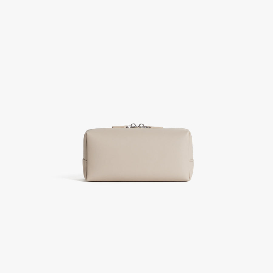 Small / Ivory (Vegan Leather) | Back view showing pocket of Metro Toiletry Case Small in Ivory